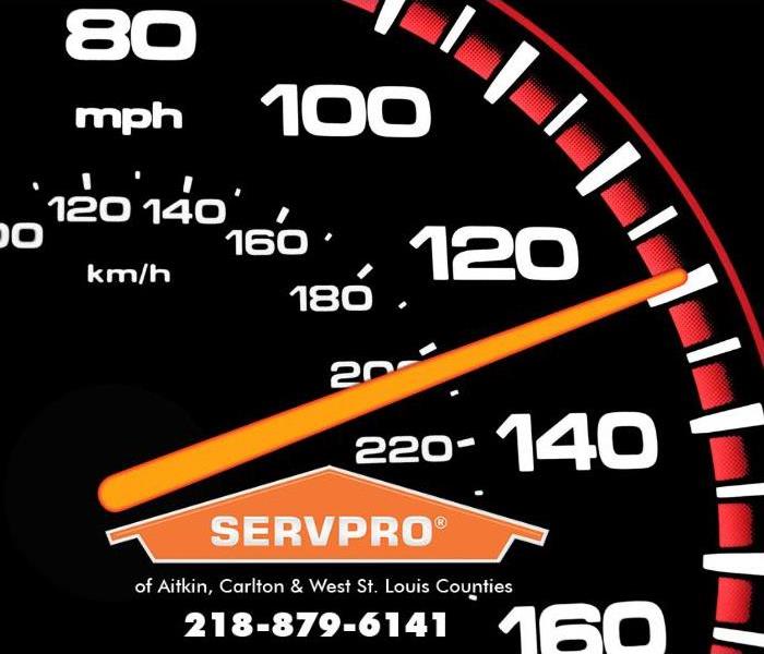 A closeup of a speedometer is shown.